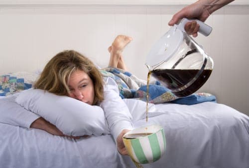 hungover woman drinking coffee