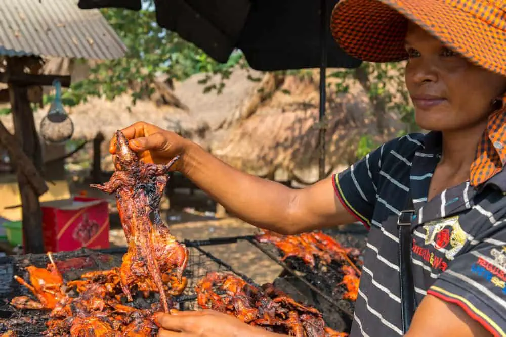 Woman Presenting Rat Meat