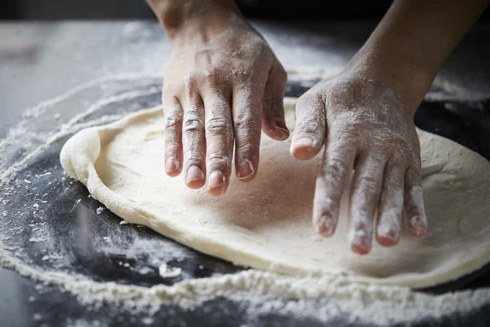 How to Stretch Pizza Dough Like A Professional