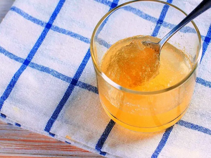 Glass of Gelatin Being Stirred