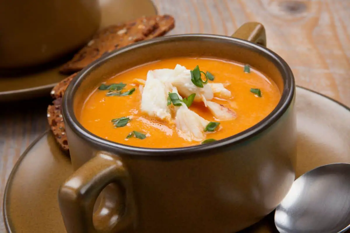 Creamy crab soup in bowl mug