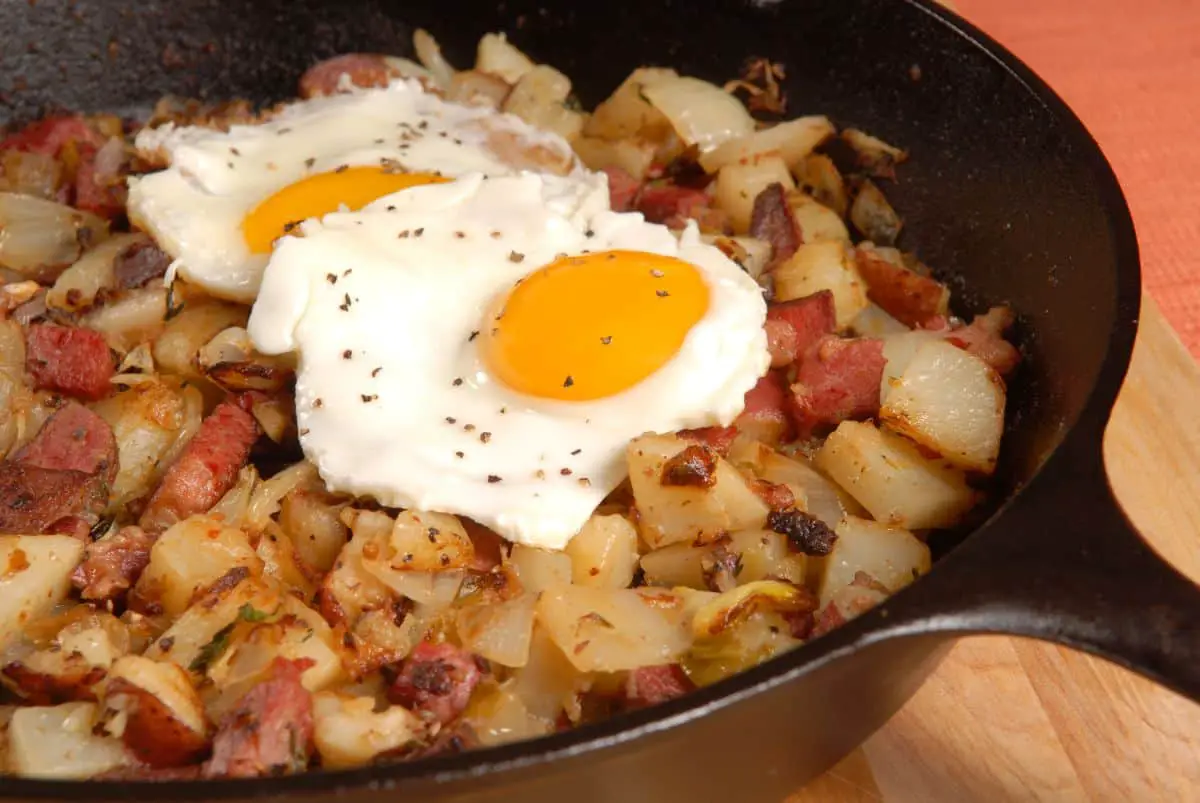 beef hash with egg in a pan