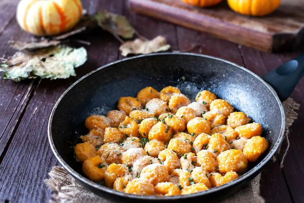 pumpkin gnocchi cooking in pan